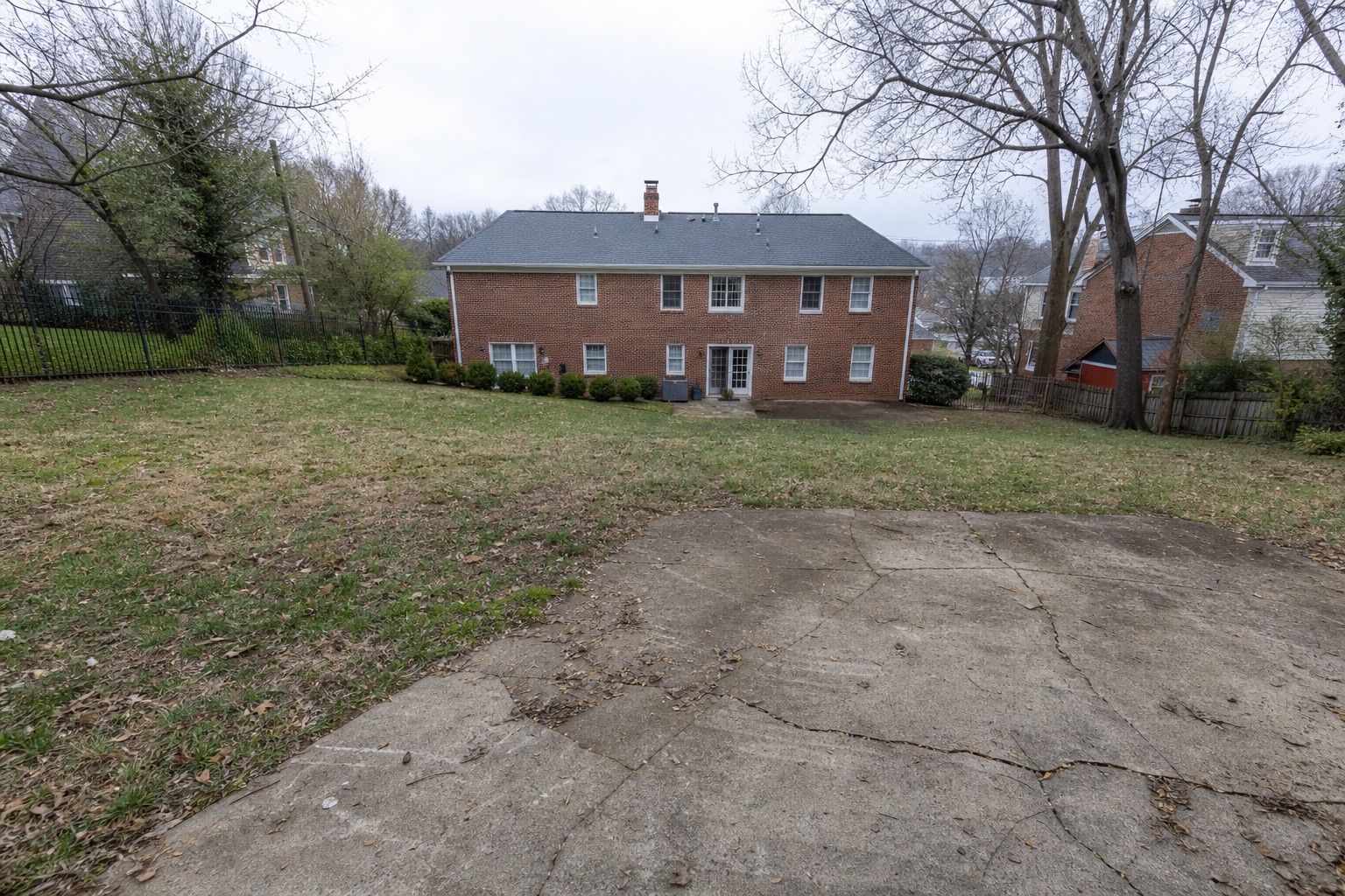 Sloping yard before court construction