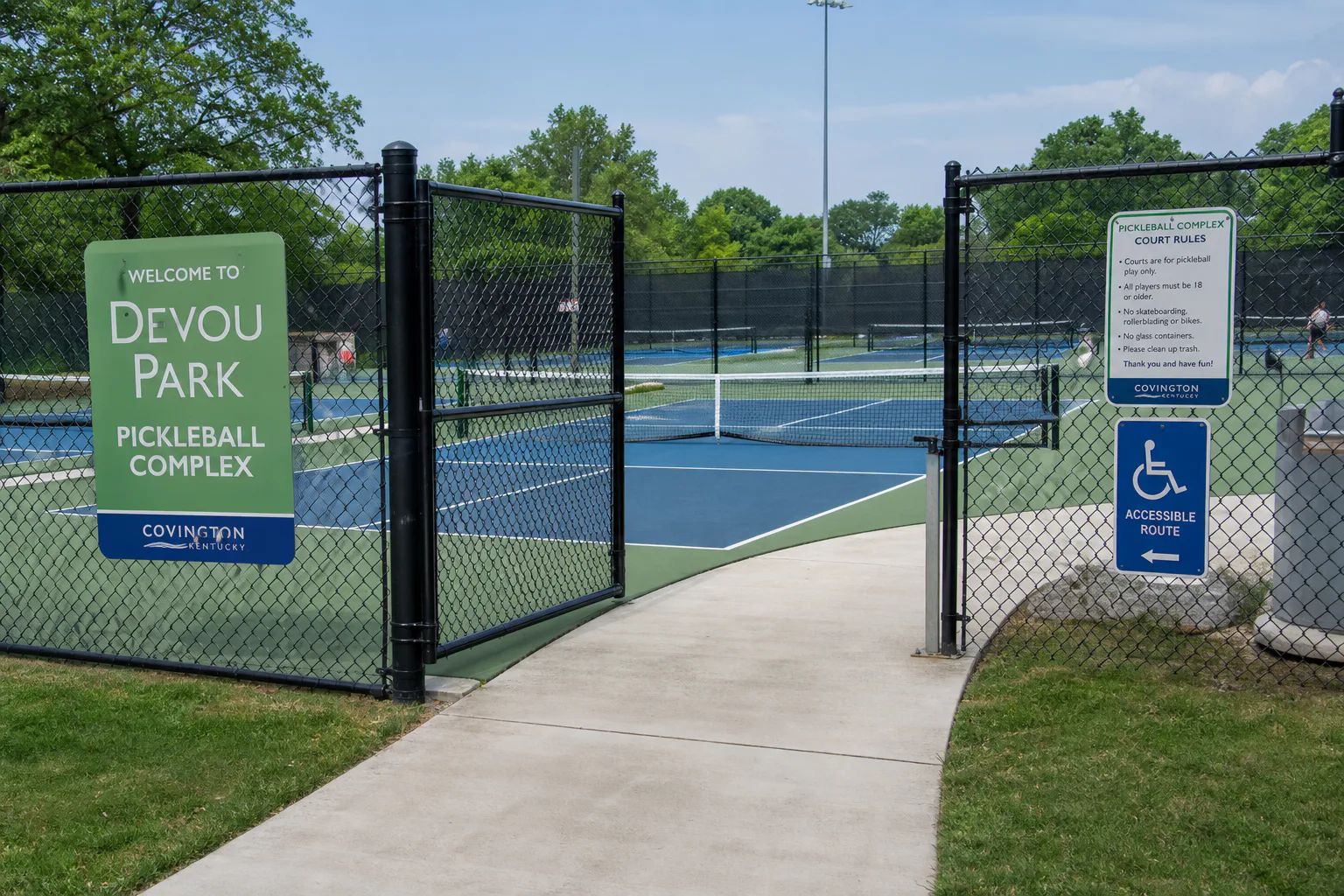 Wide accessible gate at the completed Devou Park courts