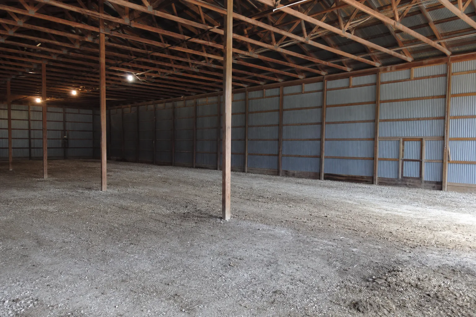 Dirt-floor interior of the Georgetown pole barn before construction