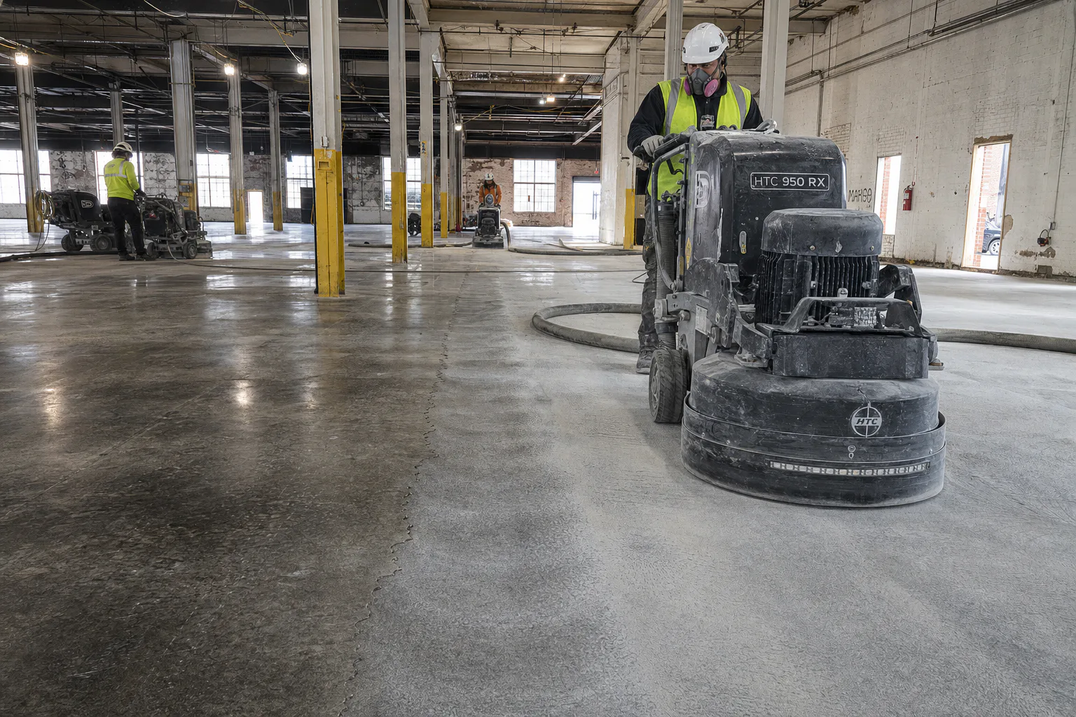 Mechanical floor preparation inside the NuLu warehouse